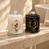 Bloom & Desire candle duo, with white Twin Rose and black Santal & Oud jars together on an ivory stone shelf
