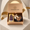 Gold & Essence Gift Box with three gold-colored roses in a black heart box and Velvet Musk perfume oil.