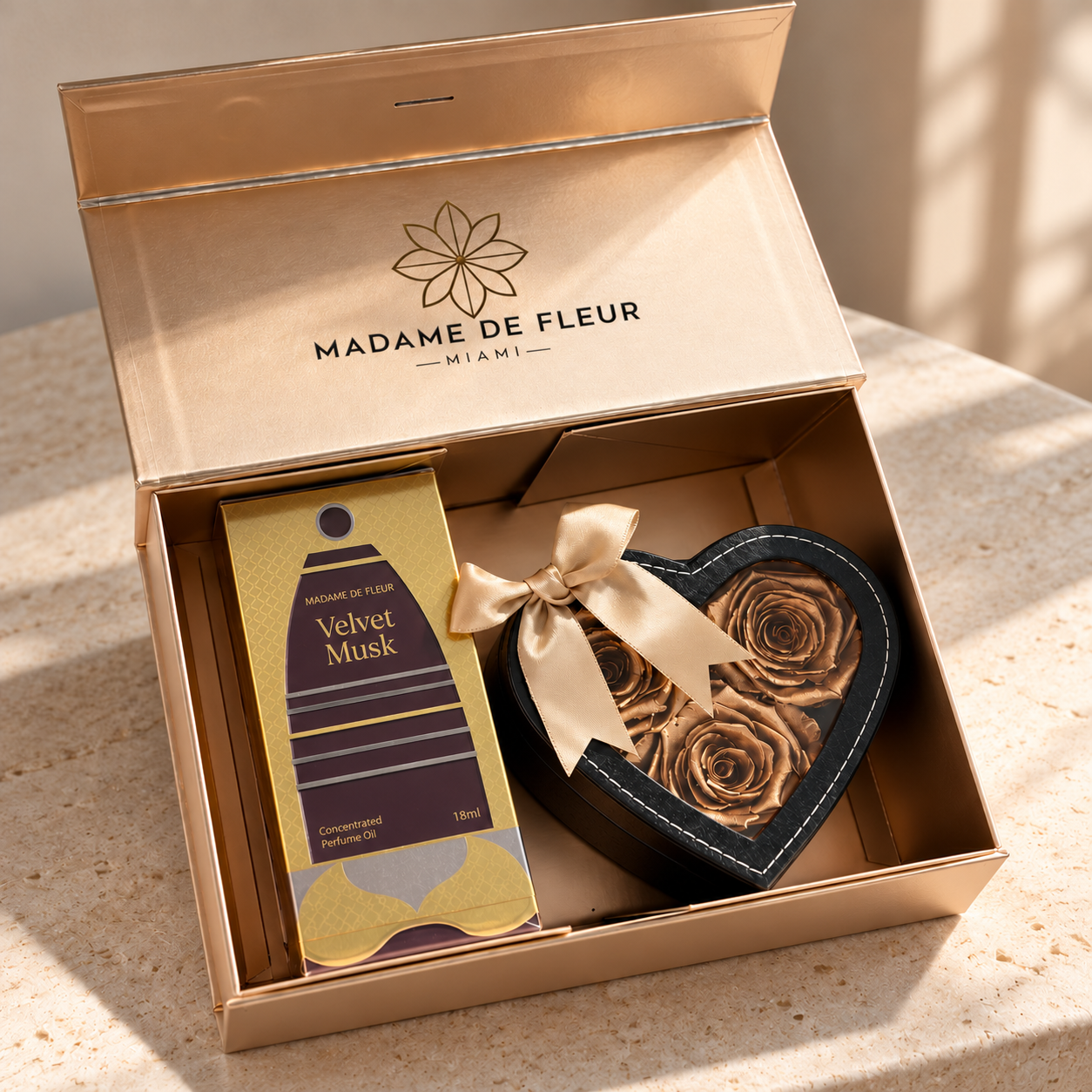 Gold & Essence Gift Box with roses and Velvet Musk perfume oil in a lifestyle setting.
