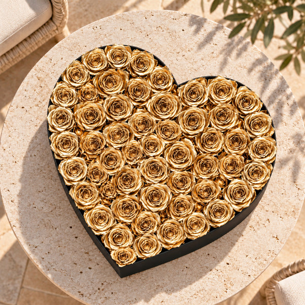 Grand black heart box with gold preserved roses, lifestyle view