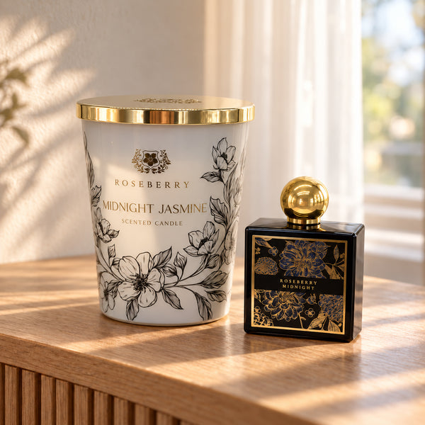 Midnight Bloom Home Fragrance Set showing the XL candle and black home-fragrance bottle together on a sideboard