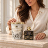 Midnight Bloom Home Fragrance Set with a model behind the XL candle and black home-fragrance bottle