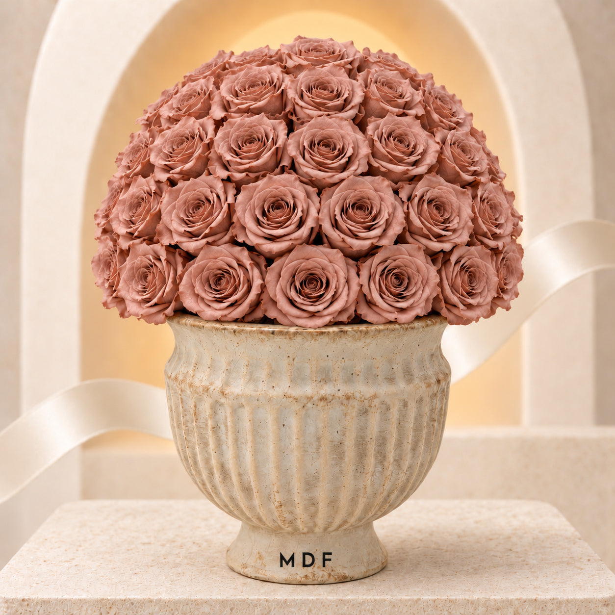 Sandora cream fluted urn with Mocha Nude preserved roses